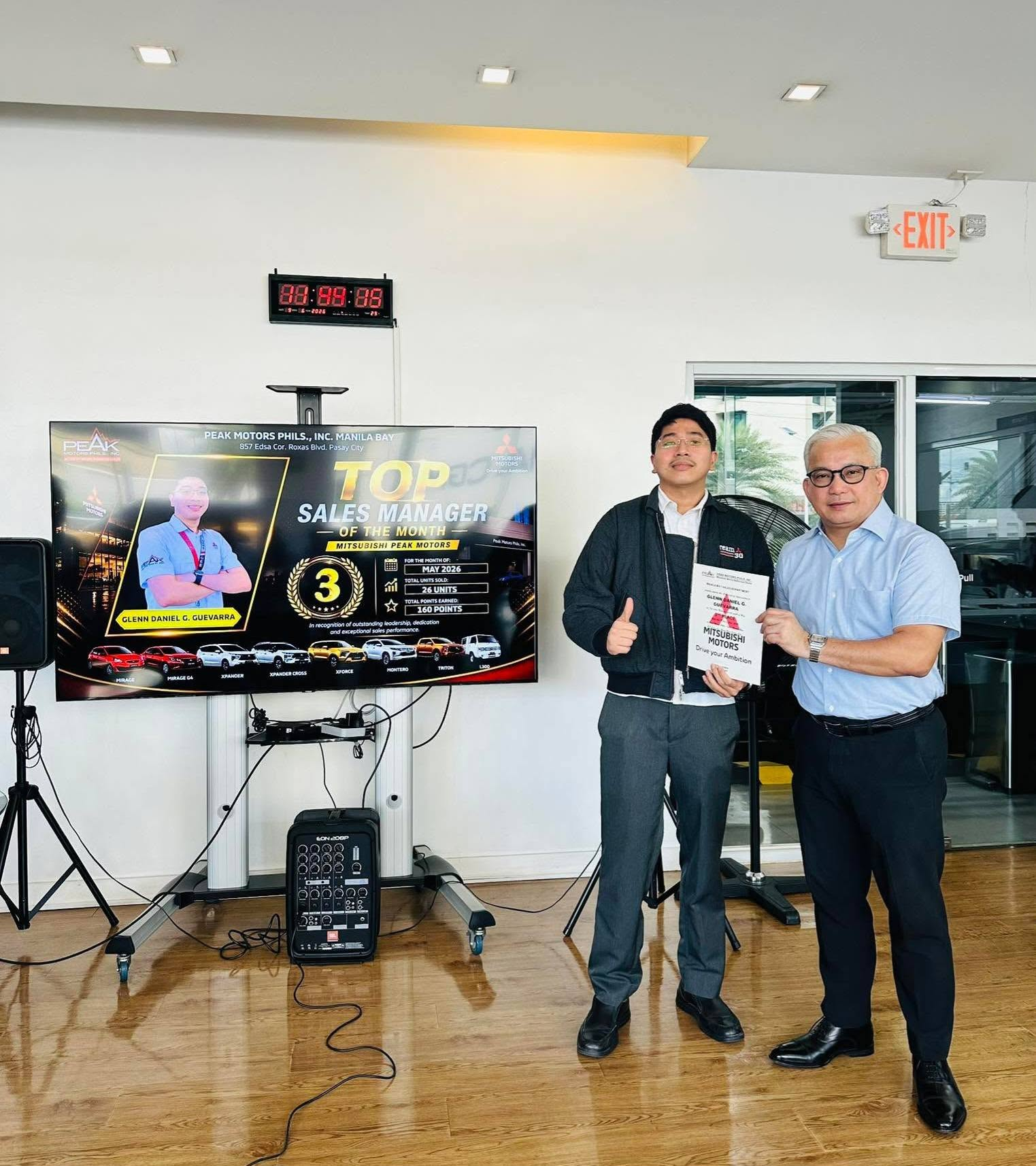 Glenn Guevarra receiving his Mitsubishi Motors sales recognition